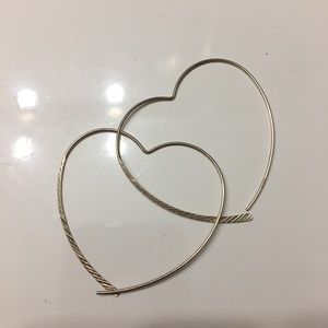Sterling silver heart shaped hoops.